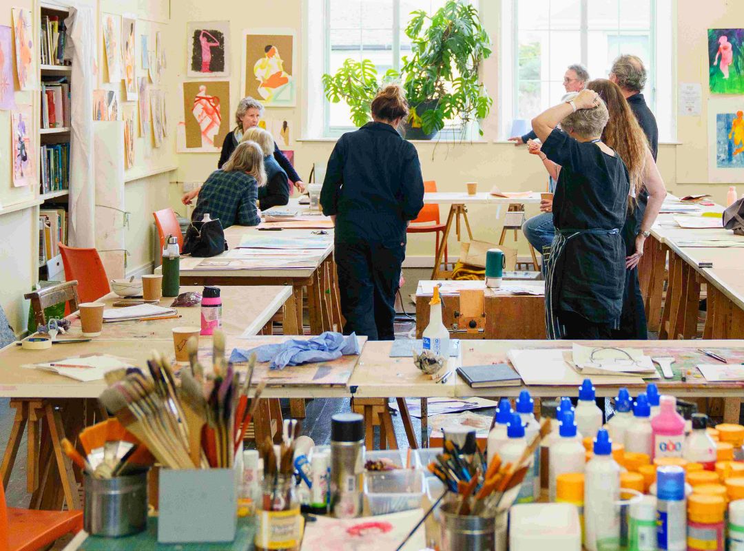 Art Students with materials in the foreground Art Students with materials in the foreground